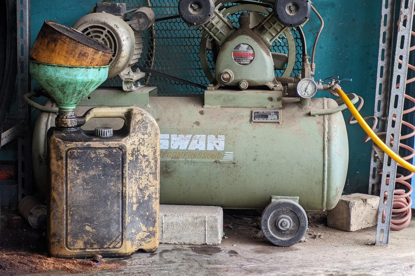 Industrial refrigeration machinery with compressors, valves and insulated pipework mounted on a plant deck.