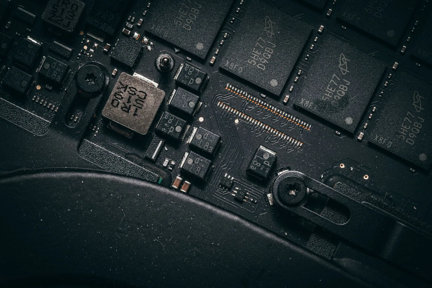 Close-up of a single-board computer module with heatsink, connectors and surface-mount components.