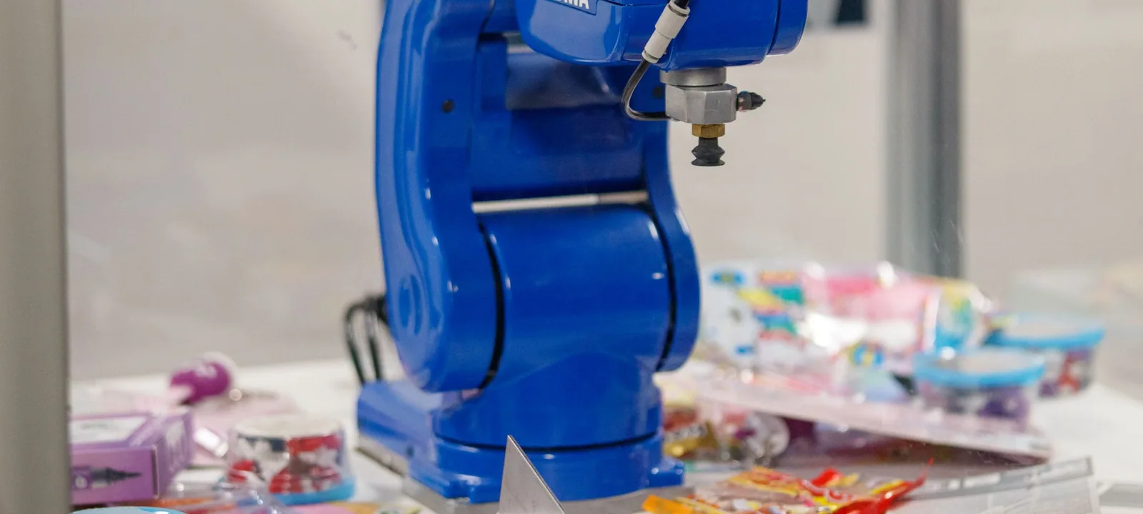 Robotic arm operating in an automated work cell.