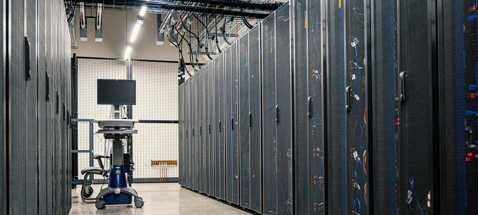 Server room racks carrying network and storage hardware.